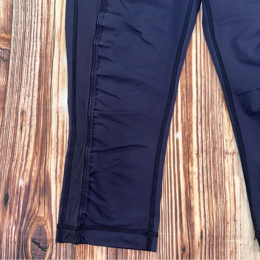 Lululemon Dark Navy ,colorful waist ban and slightly cropped leggings Size 8.